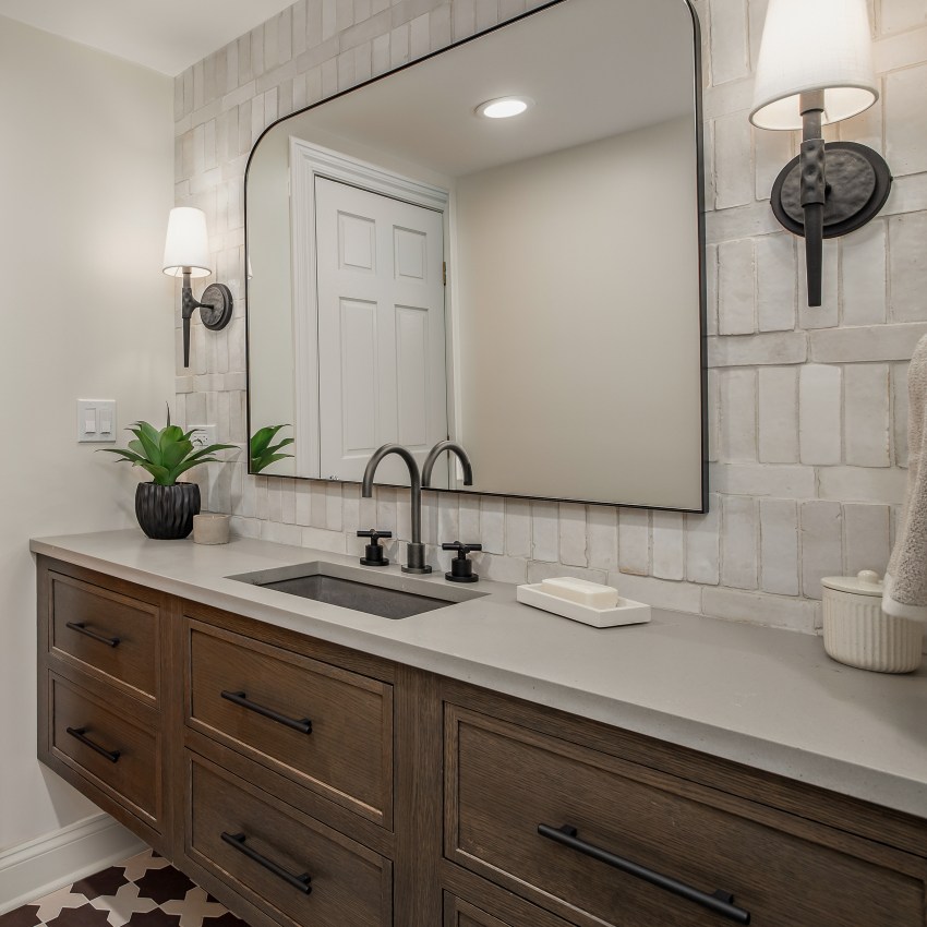 Recent bathroom remodel in Downers Grove, Illinois featuring a freestanding soaking tub, frameless glass shower, and a double vanity with marble countertop