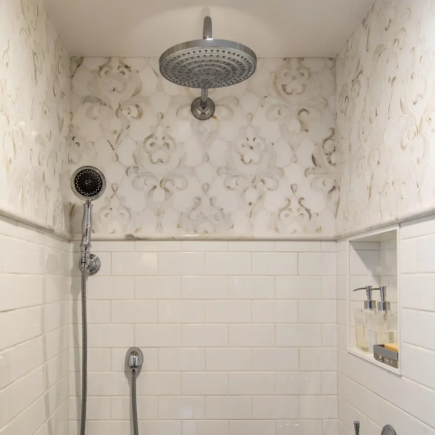 Shower with subway tile, a dual showerhead and chrome fixtures