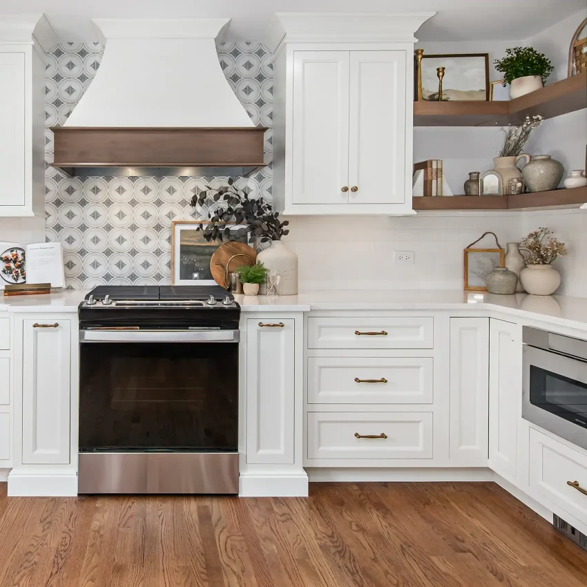 White kitchen cabinets with open wood shelving and a diamond-pattern backsplash